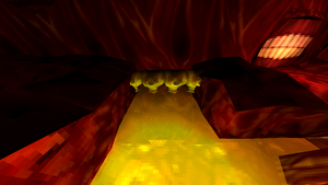 An overlook of a spinal bridge connecting two fleshy platforms, with an acid lake revealing a hole below.