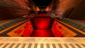 A view downward into an active crusher, where a blood waterfall behind it flows into a shallow pool below.